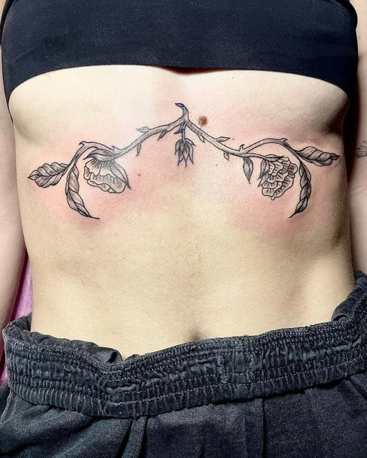 Medium Blackwork Flowers and Vines Tattoo on Women Stomach by @poison.well