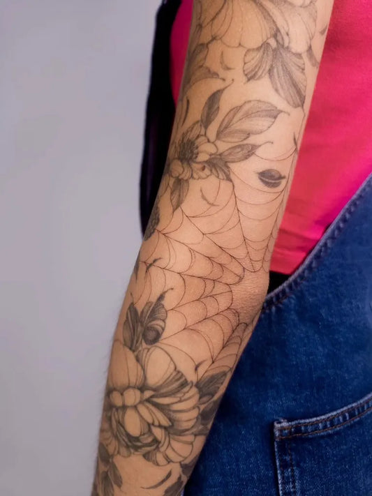Medium Blackwork Flowers and Web Tattoo on Women Elbow by @tattoosby_elise