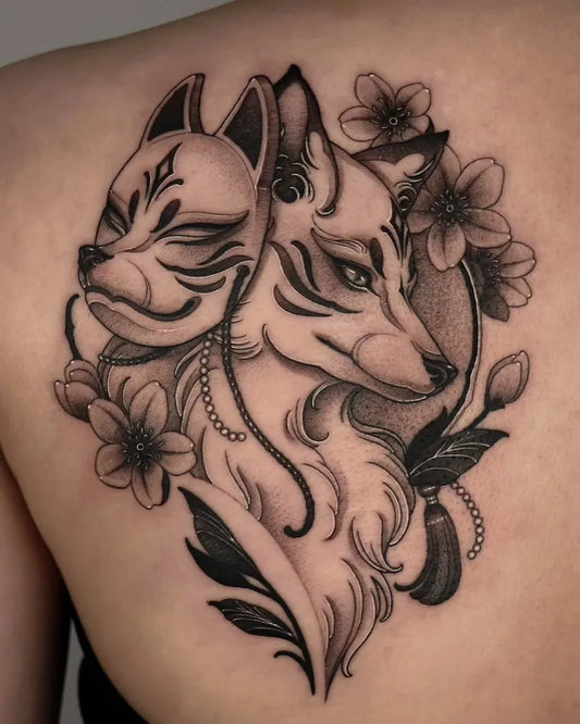 Medium Blackwork Fox Masks and Cherry Blossoms Tattoo on Women Shoulder by @sadi_tattooer