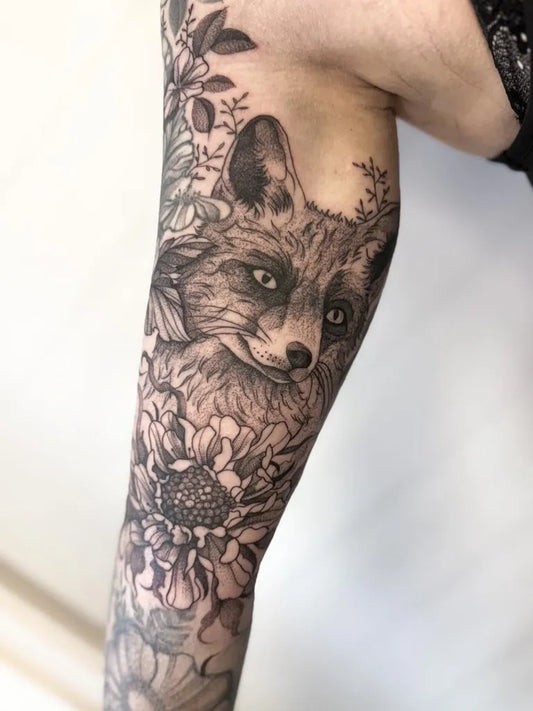 Medium Blackwork Fox and Flowers Tattoo on Women Upper Arm by @littleferntattoo