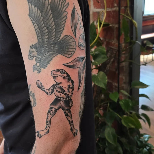 Medium Blackwork Frog and Eagle Tattoo on Men Arm by @mitchpleasance