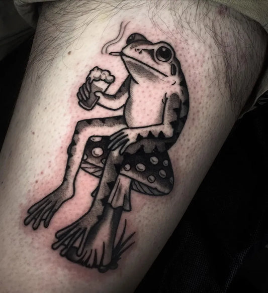 Medium Blackwork Frog on Mushroom Tattoo on Men Arm by @olivialeigh.tattoo