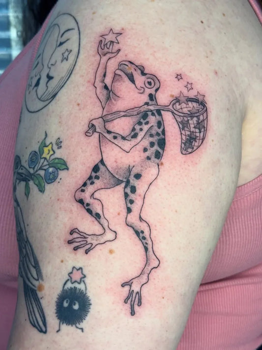 Medium Blackwork Frog with Net and Moon Tattoo on Women Arm by @alyssamayart