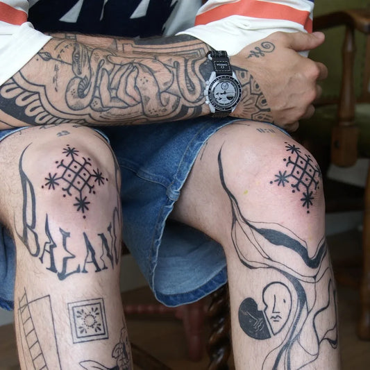 Medium Blackwork Geometric Star Tattoo on Men Knee by @jadejay.ink