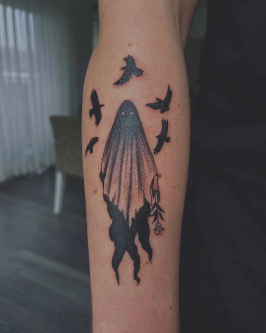 Medium Blackwork Ghost with Birds Tattoo on Women Arm by @nina_arttattoo
