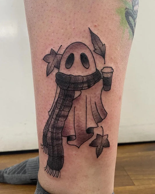 Medium Blackwork Ghost with Scarf and Leaves Tattoo on Women Leg by @laurenapriltattoo