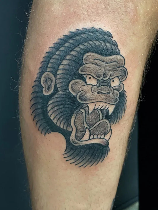 Medium Blackwork Gorilla Tattoo on Men Leg by @dylanconnortattoos