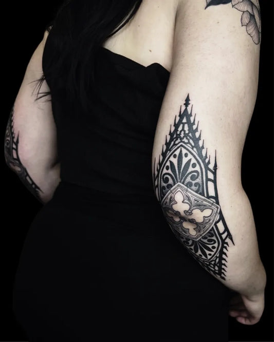 Medium Blackwork Gothic Arch Tattoo on Women Elbow by @needle.mistress