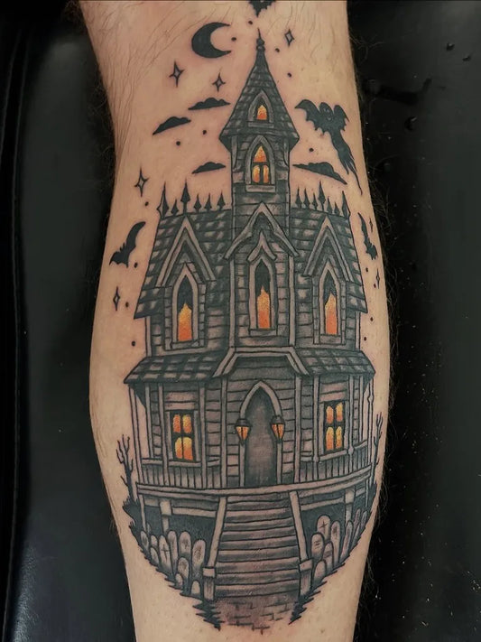 Medium Blackwork Haunted House Bats Tombstones Halloween Tattoo on Men Leg by @alexramiltattoo