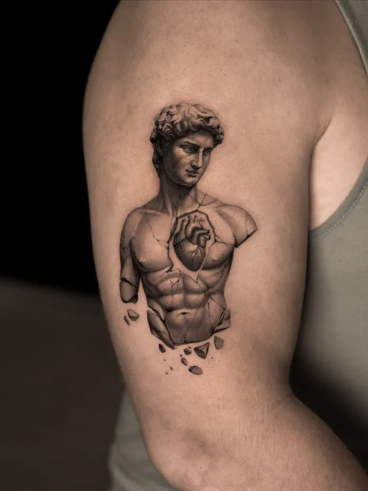 Medium Blackwork Heart Bust on Men Arm Tattoo by @michael.gaiman