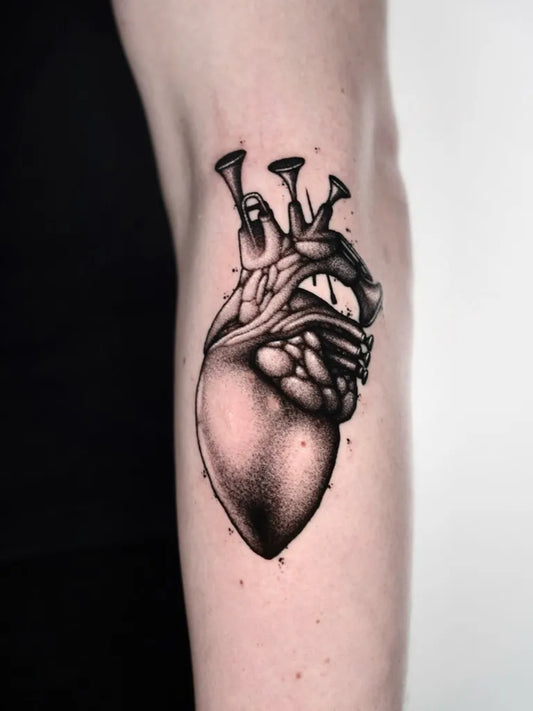 Medium Blackwork Heart with Tubes on Women Arm Tattoo by @ohrwyrd
