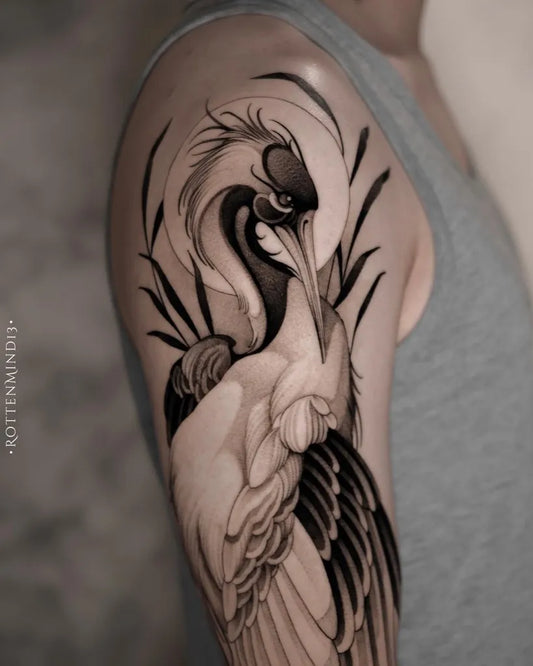 Medium Blackwork Heron Wings Tattoo on Men Arm by @evitas.atelier