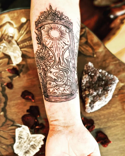 Medium Blackwork Hourglass Flowers Tattoo on Women Arm by @marysmiles