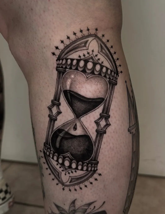 Medium Blackwork Hourglass Heart Tattoo on Women Thigh by @livtaylortattoos