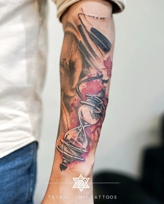 Medium Blackwork Hourglass and Tribal Tattoo on Men Arm by @tribalinktattoos