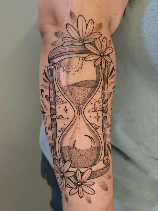 Medium Blackwork Hourglass with Flowers Tattoo on Men Arm by @csankeytat2s