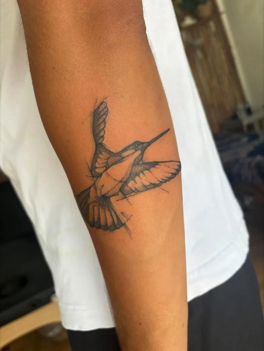Medium Blackwork Hummingbird Tattoo on Men Arm by @thebayinksamui