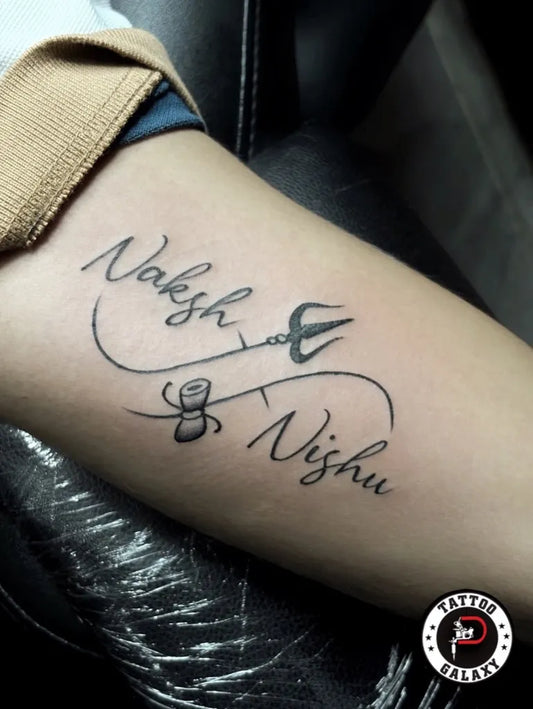 Medium Blackwork Infinity Trishul Names Tattoo on Women Arm by @thetattoogalaxy