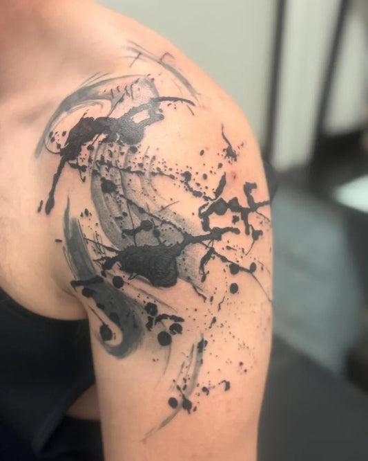 Medium Blackwork Ink Splatter Tattoo on Men Bicep by @basicwitchtattoo