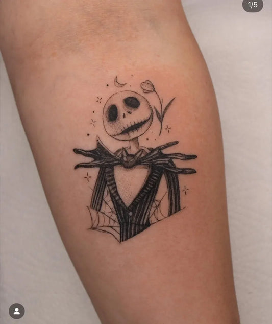 Medium Blackwork Jack Skellington with Spiderweb Horror Tattoo on Women Arm by @tattoo_piathaleia