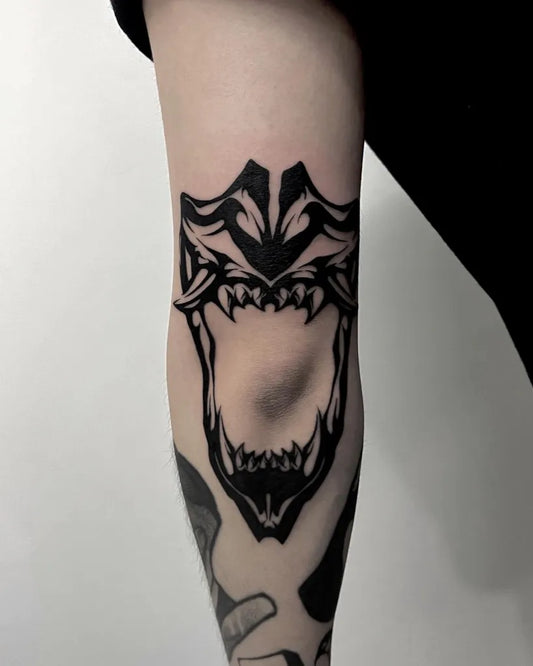 Medium Blackwork Jaw Mask Tattoo on Men Elbow by @ssammugonzo
