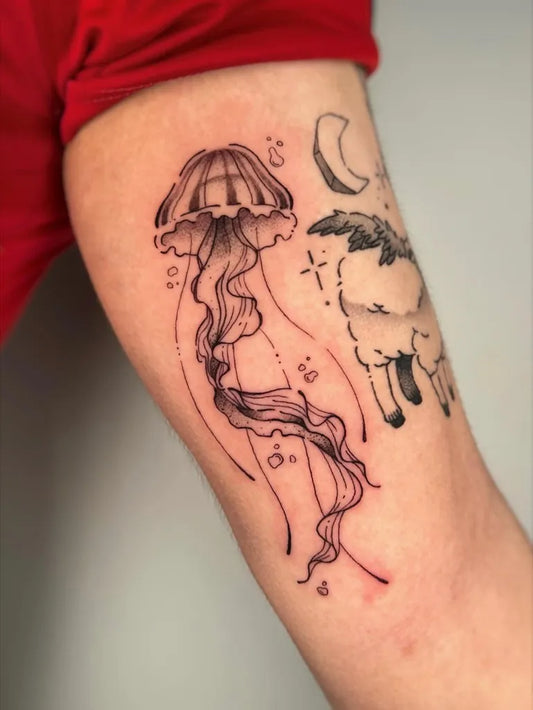 Medium Blackwork Jellyfish Moon Sheep Tattoo on Women Arm by @wammy.inks