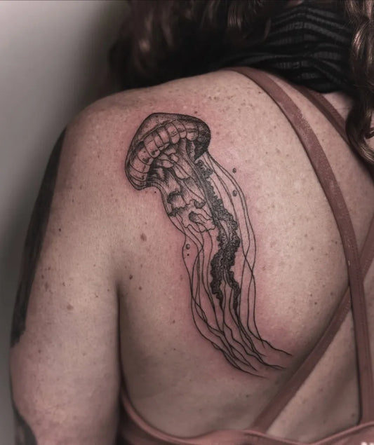 Medium Blackwork Jellyfish Tattoo on Women Shoulder by @katelumos