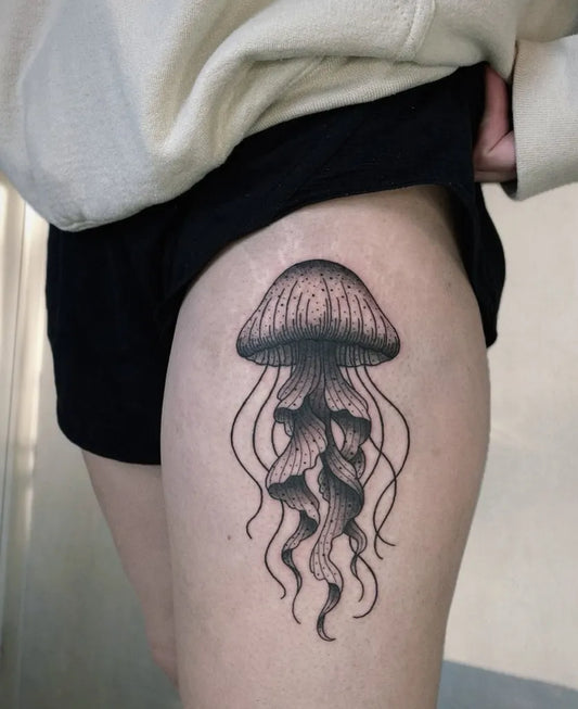 Medium Blackwork Jellyfish Tattoo on Women Thigh by @hemlocktattoostudio