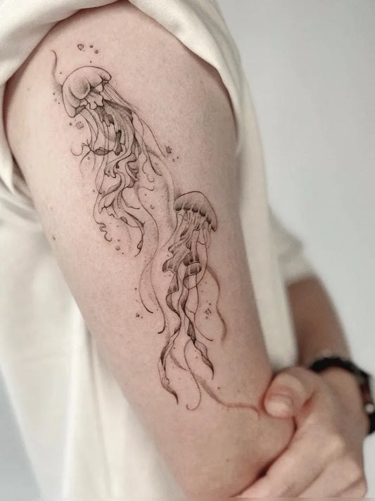 Medium Blackwork Jellyfish Tattoo on Women Upper Arm by @franchesca_tattoo