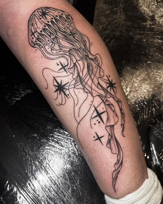 Medium Blackwork Jellyfish with Stars Tattoo on Women Thigh by @tatt.onie