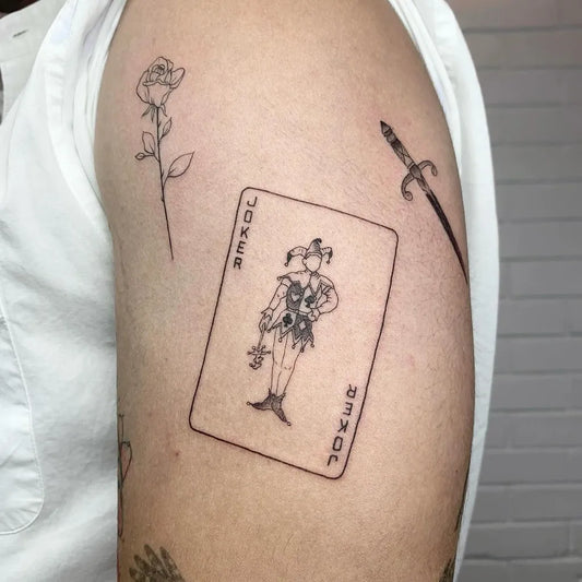 Medium Blackwork Joker Rose Dagger on Men Arm Tattoo by @classikabarbers