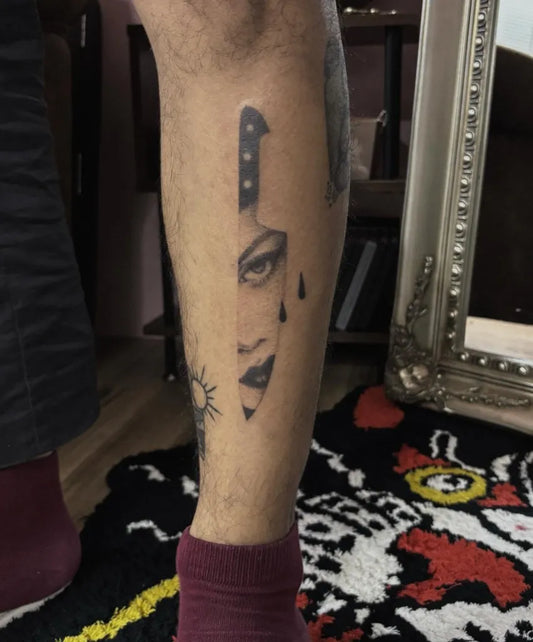 Medium Blackwork Knife Face Tattoo on Men Leg by @iiris_ink