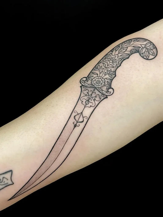 Medium Blackwork Knife Tattoo on Men Arm by @ouija.ink