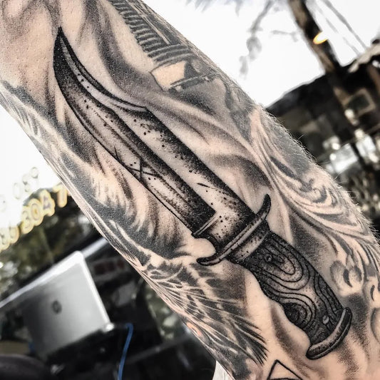 Medium Blackwork Knife Tattoo on Men Arm by @tos_tattoo