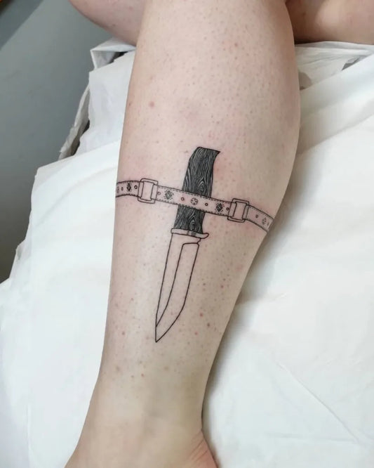 Medium Blackwork Knife and Belt Tattoo on Women Thigh by @jessmarshall_tattooartist