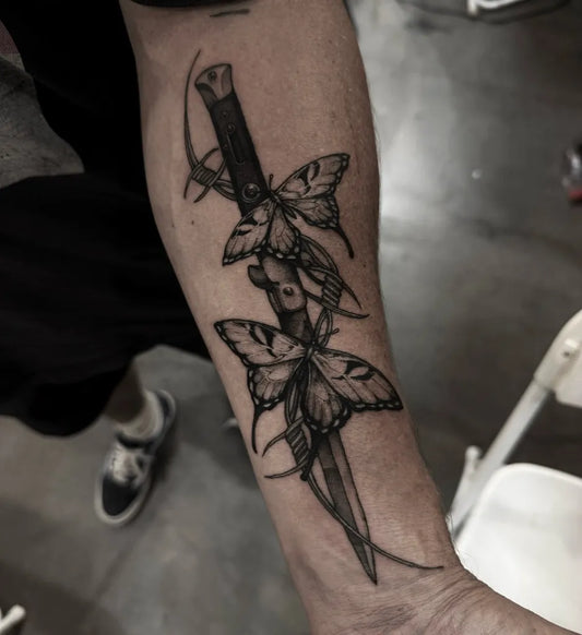 Medium Blackwork Knife and Butterflies Tattoo on Men Arm by @yongha_blk