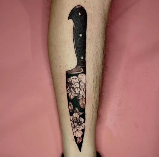 Medium Blackwork Knife and Flowers Tattoo on Men Leg by @shelbywinonatattoo