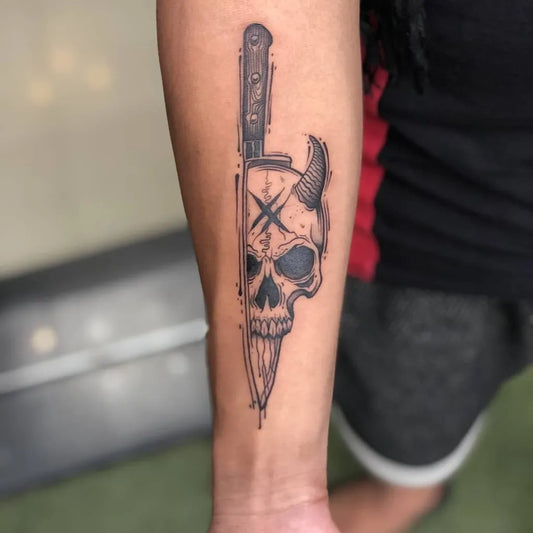 Medium Blackwork Knife and Skull Tattoo on Women Arm by @tattoonashajaipur