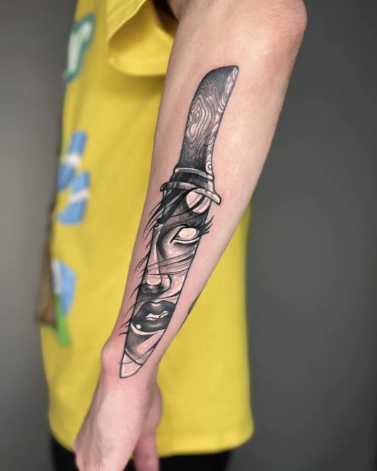 Medium Blackwork Knife with Face Tattoo on Men Arm by @eddy_s_tattoos