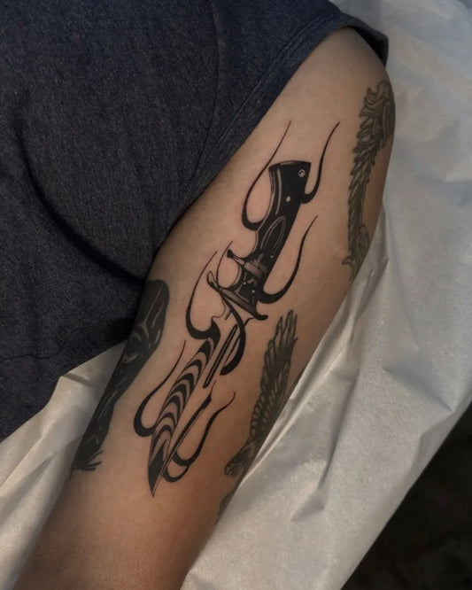 Medium Blackwork Knife with Flames Tattoo on Men Arm by @_brunoink