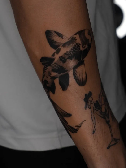 Medium Blackwork Koi Fish Tattoo on Men Arm by @evatattooer
