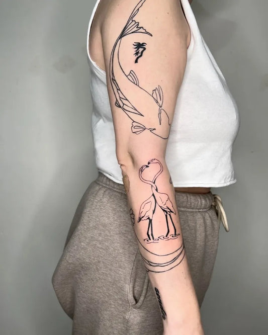 Medium Blackwork Koi and Flamingos Tattoo on Women Arm by @lre_ink