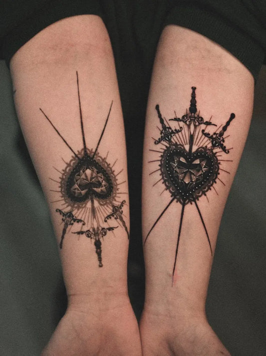 Medium Blackwork LaceHeartwithDaggers Tattoo on Women Arms by @dante.impaler
