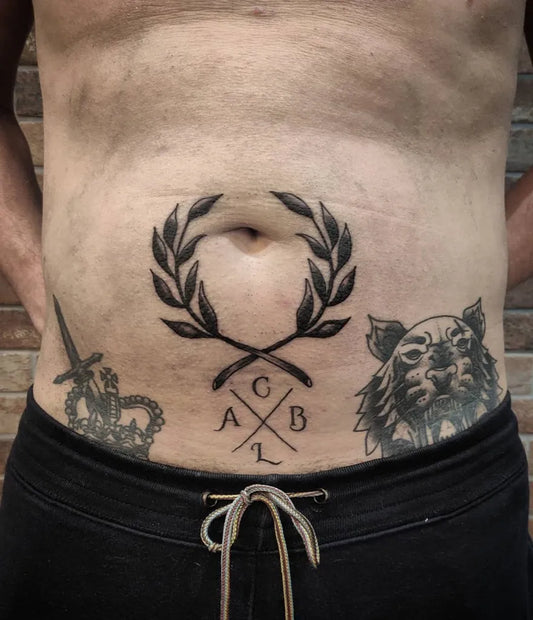 Medium Blackwork Laurel Wreath Crown Dagger Tattoo on Men Abdomen by @alexrobinsontattoo