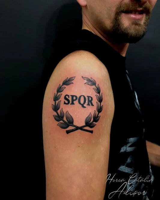 Medium Blackwork Laurel Wreath SPQR Tattoo on Men Shoulder by @horea.tattoo