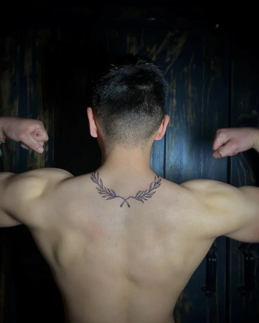 Medium Blackwork Laurel Wreath Tattoo on Men Back by @nadiabynature__