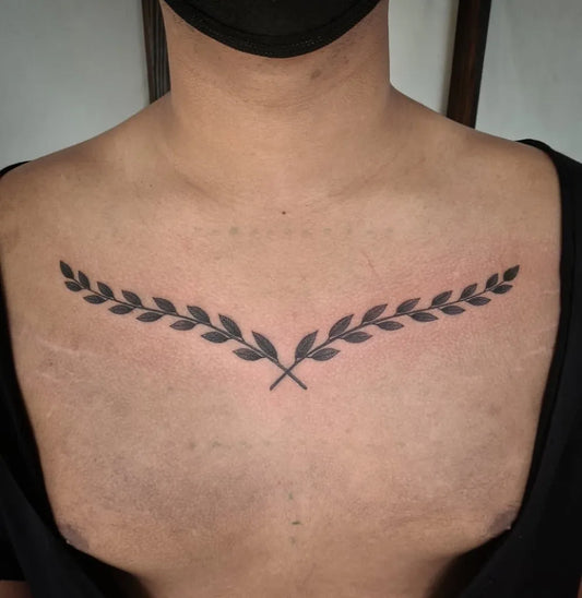 Medium Blackwork Laurel Wreath Tattoo on Men Chest by @couldbe_chris