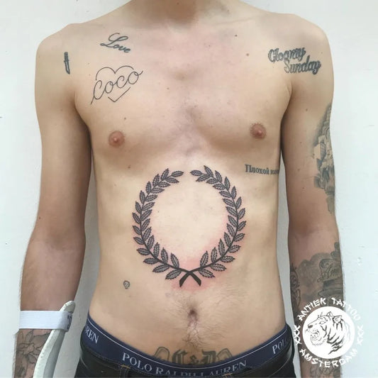 Medium Blackwork Laurel Wreath Tattoo on Men Stomach by @antiektattoo
