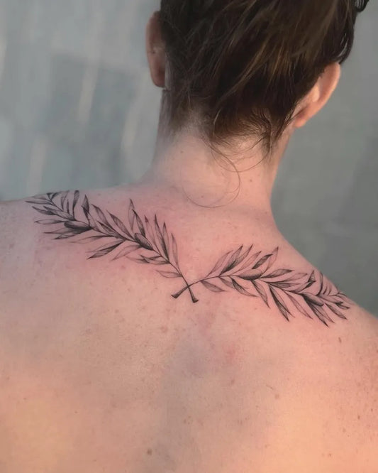 Medium Blackwork Laurel Wreath Tattoo on Women Back by @d.vancasso.ink