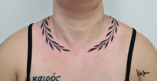 Medium Blackwork Laurel Wreath Tattoo on Women Neck by @vikijammmtattoo